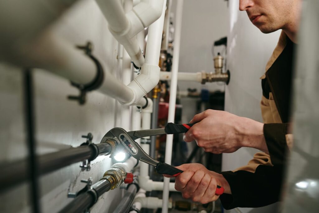 Plumbers maintaining commercial plumbing pipes in Fort Pierce