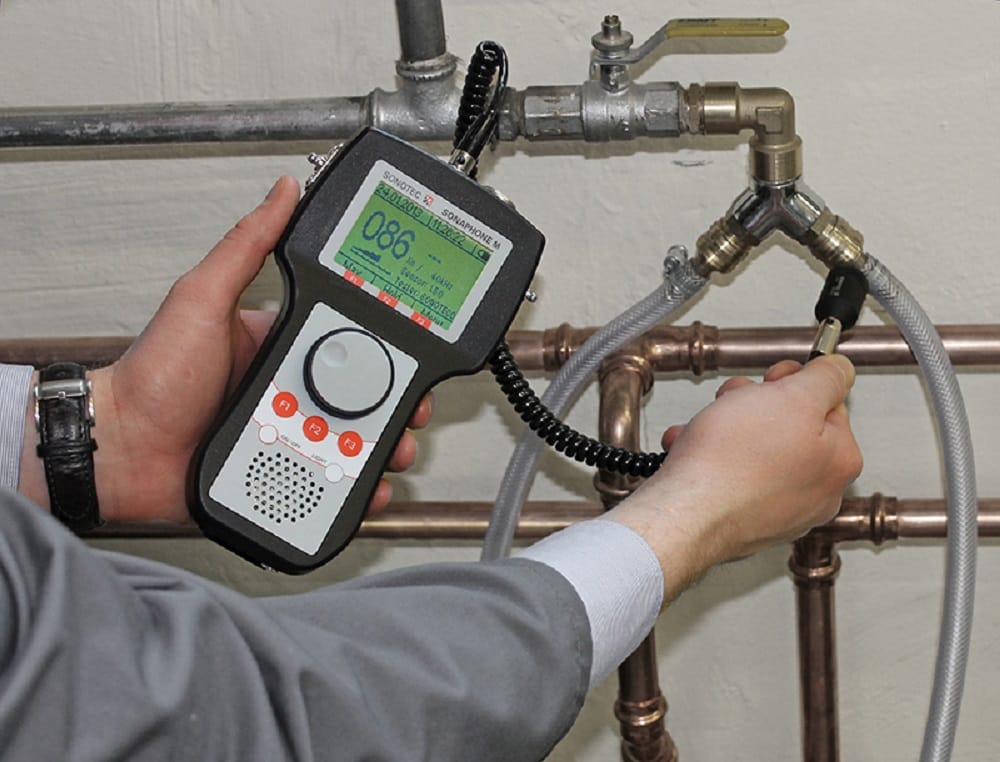 Plumber testing pipes with electronic leak detection equipment in Fort Pierce